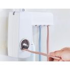 Dávkovač zubní pasty s držákem zubních kartáčků v bílé barvě